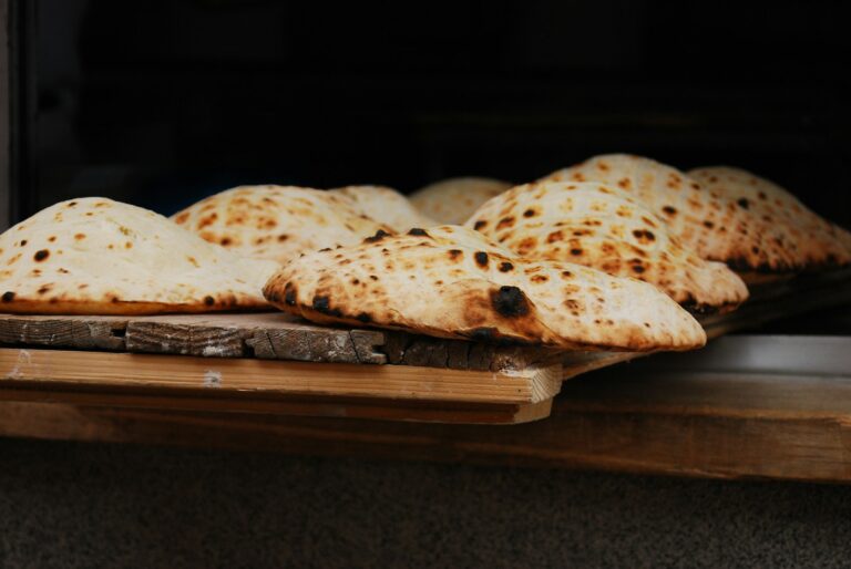 Warm pita bread stack tea towel