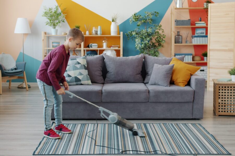 Parents children cleaning living room weekend reset