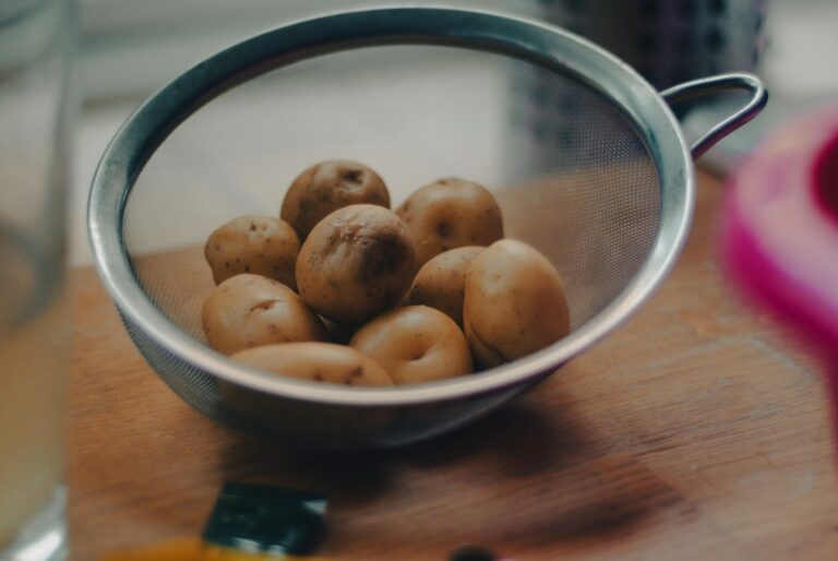 Parboiling potato batons colander