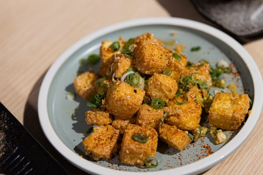 Crispy fried tofu cubes sprinkled with green onions