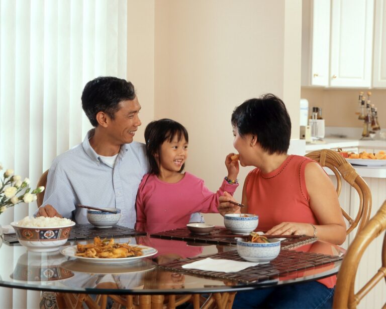 Parent reading bedtime story family dinner table conversation