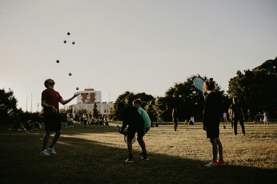 Family playing ball games park