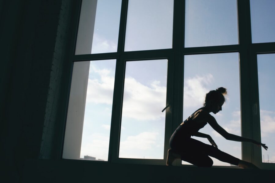 Morning home stretching yoga mat window