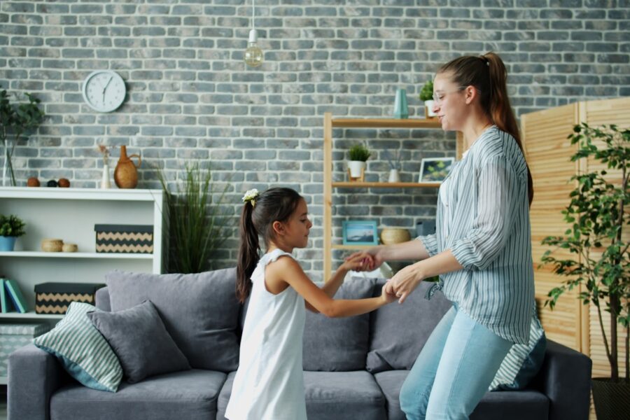 Two kids playing together living room