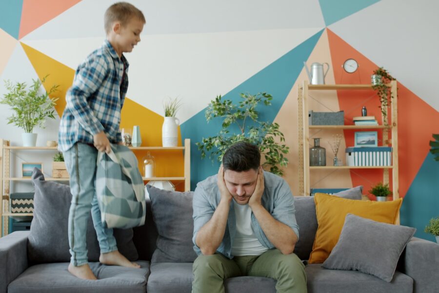 Parent child talking sofa living room