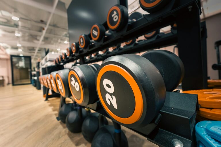 Crowded gym free weights people training