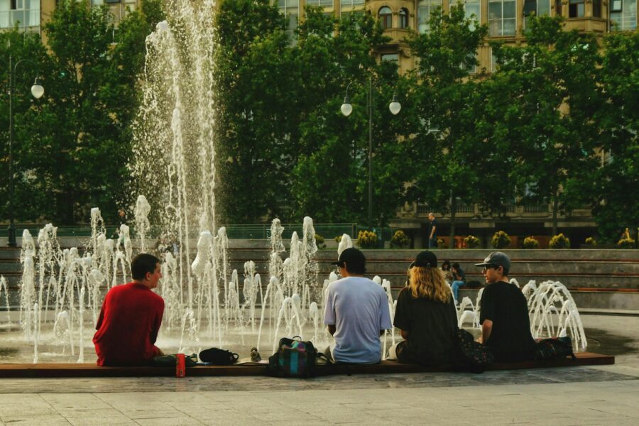 City square fountain summer people sitting