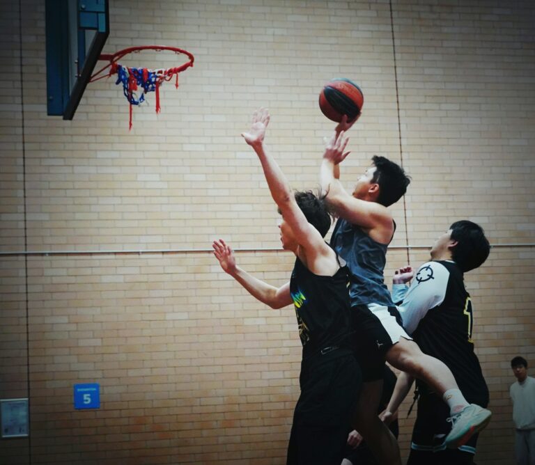 Adult basketball pickup game indoor court