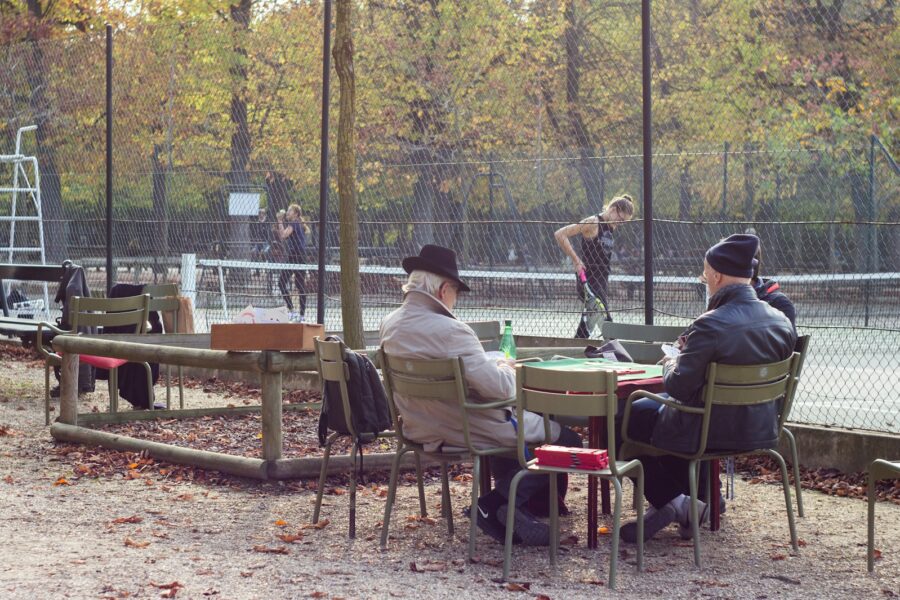Tennis doubles match outdoor court friends