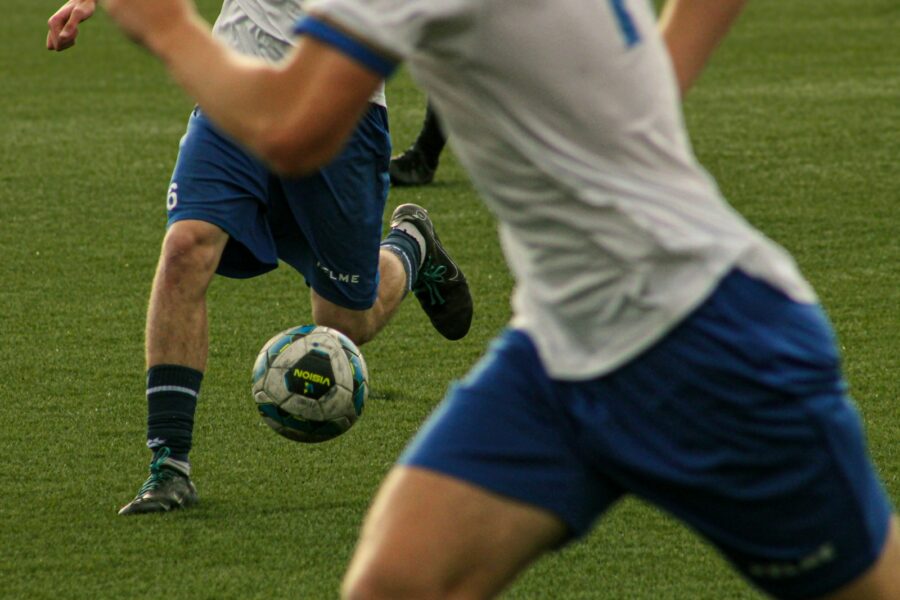 soccer players pressing midfielder ball