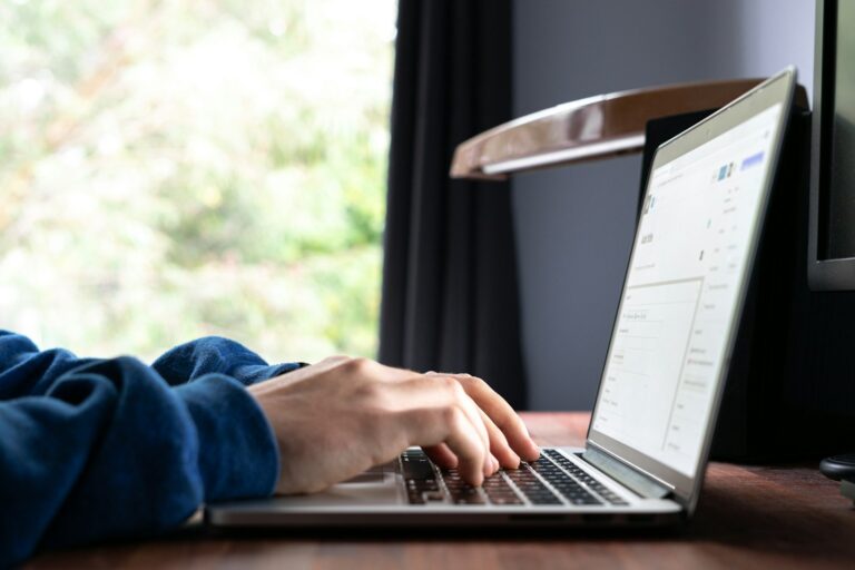 Person typing laptop assistant chat window