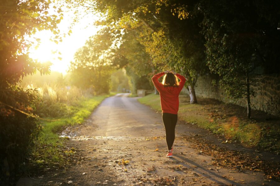 Runner dynamic stretches track sunrise