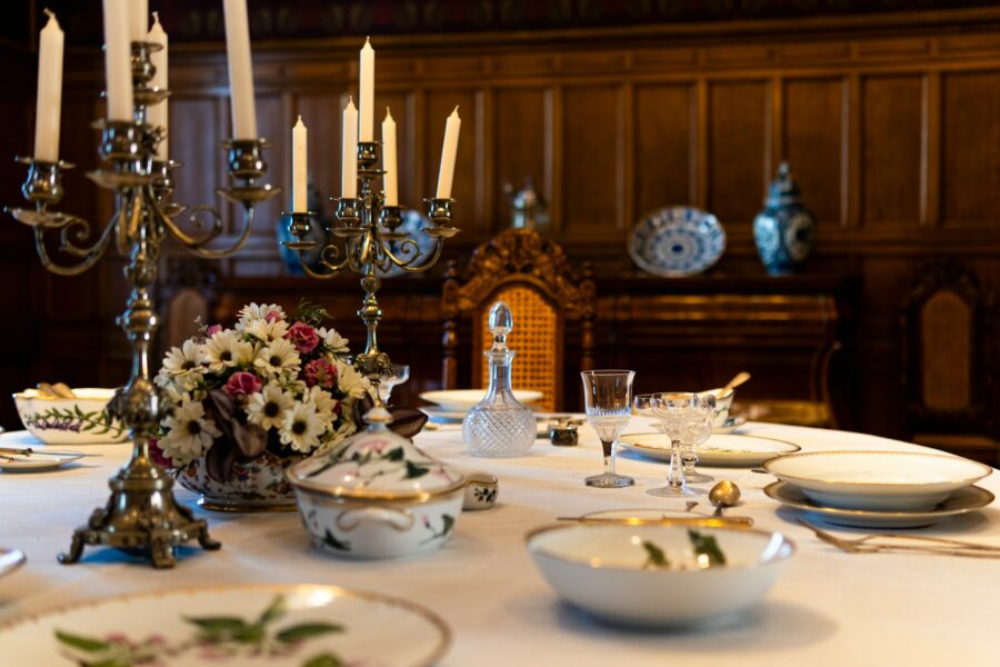Dining table potluck spread serving dishes candles