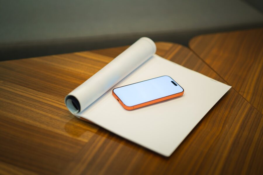 Wireless headphones wooden desk smartphone
