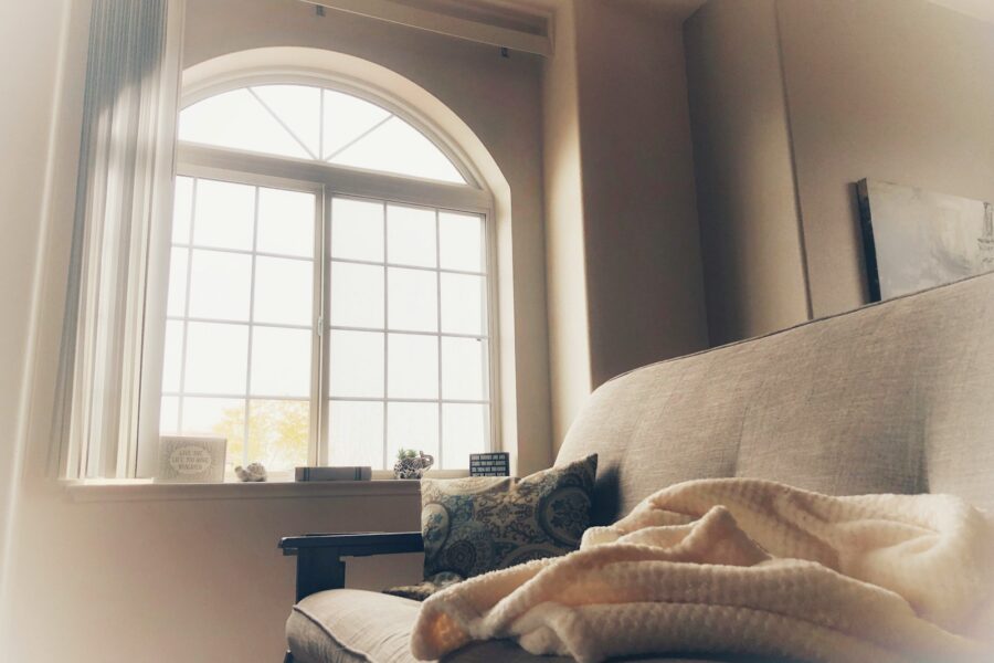 Cozy living room couch blanket tea book