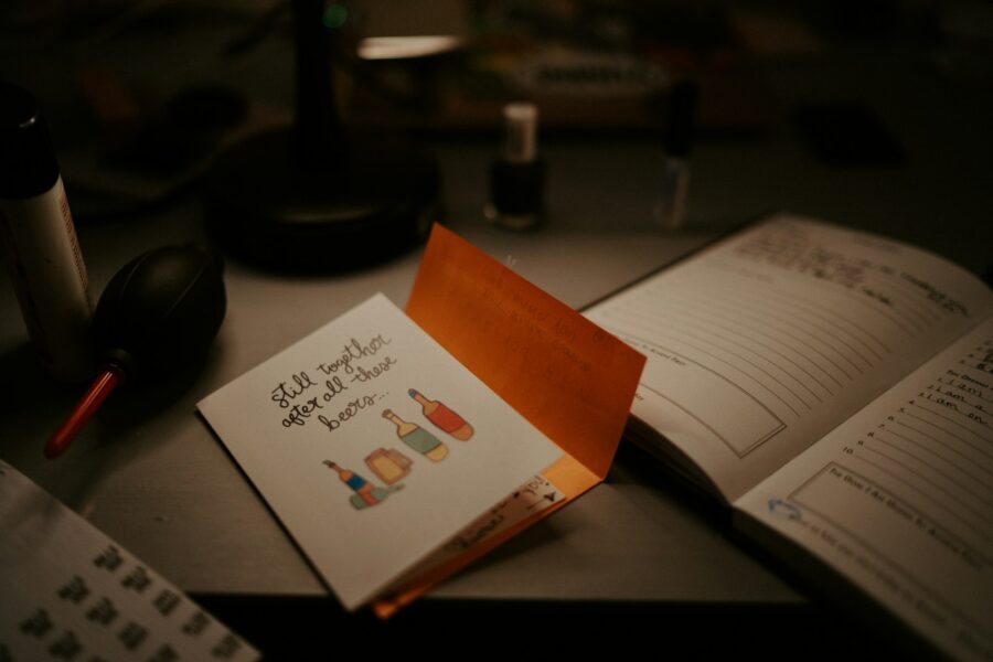 Notebook pen medication bottles appointment card