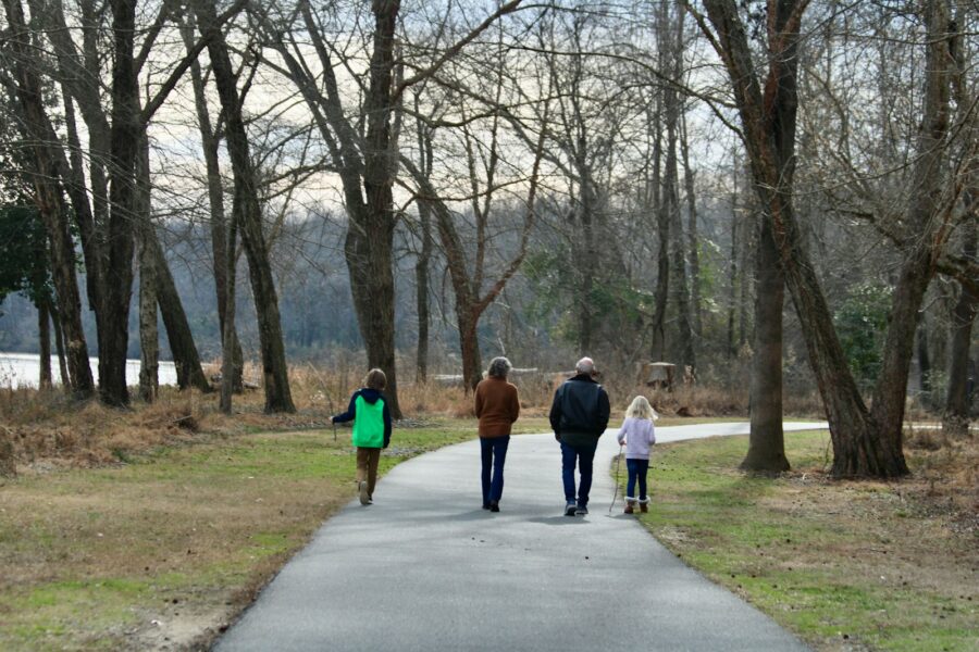 Family running together park morning