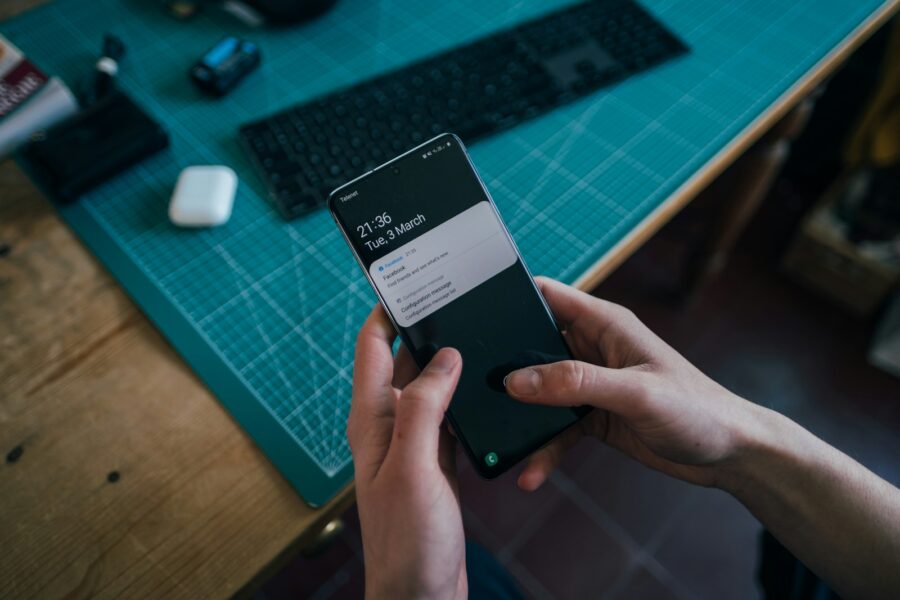 Person turning off smartphone notifications screen