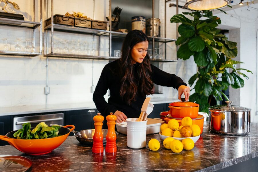 Woman choosing fruit over candy kitchen