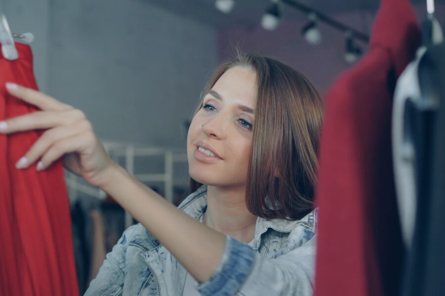 Person choosing clothes wardrobe morning light