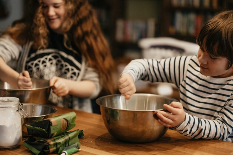 Child measuring flour baking bowl