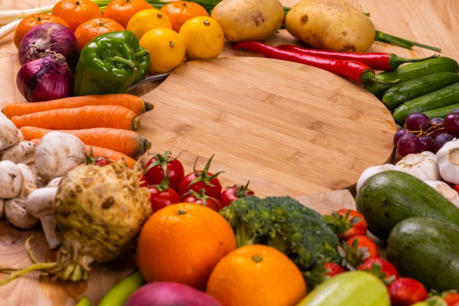 Reusable grocery bags fruit vegetables wooden table