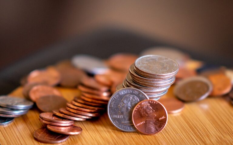 Kids counting coins wooden table