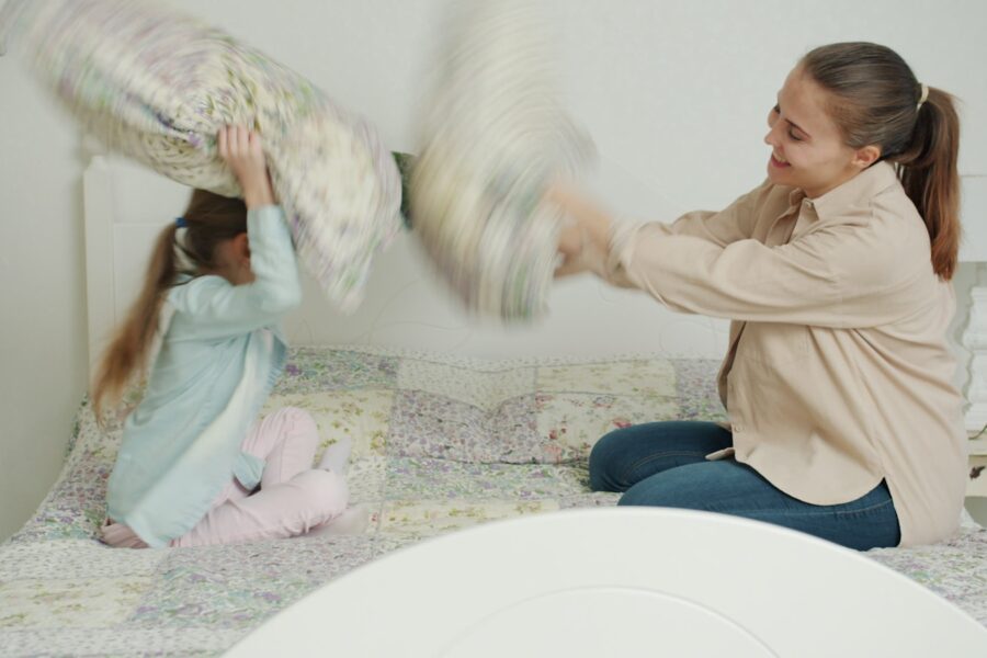 Parent child doing laundry together
