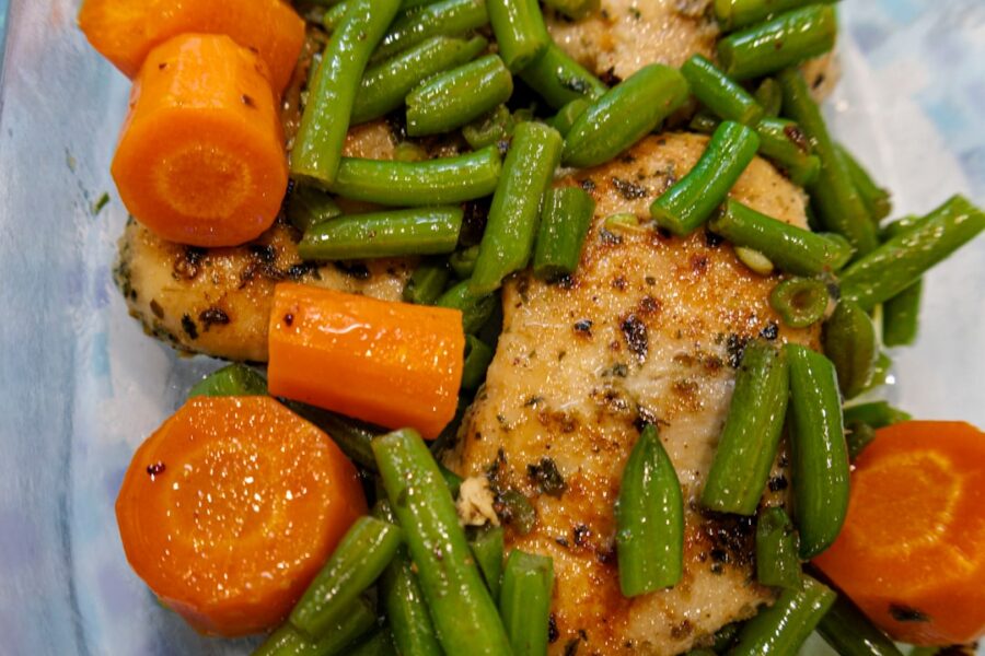 Cooked chicken breast with carrots and green beans