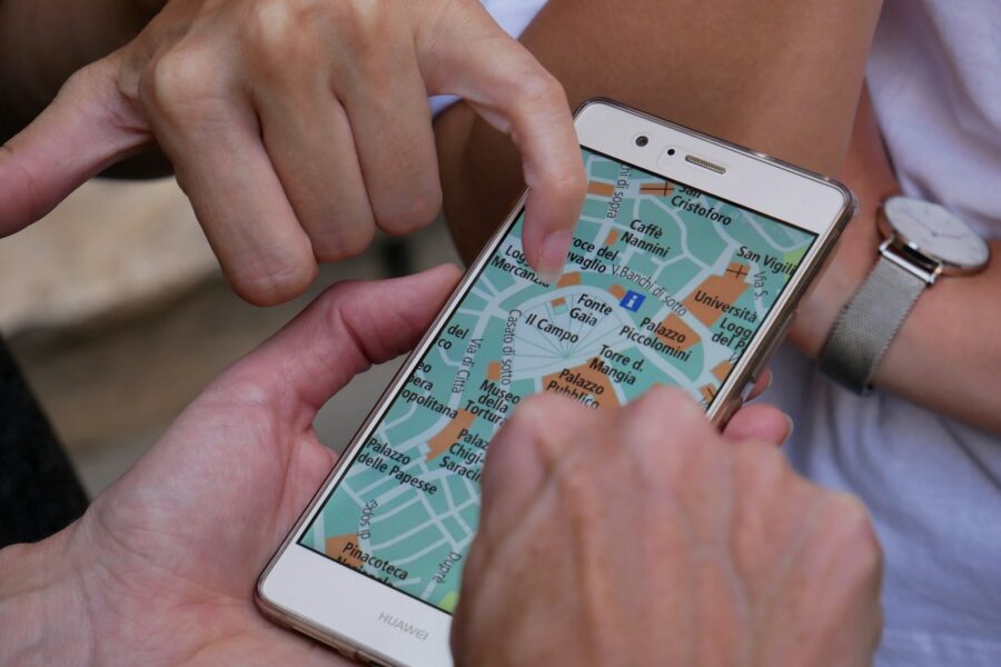 Traveler using smartphone offline map foreign city