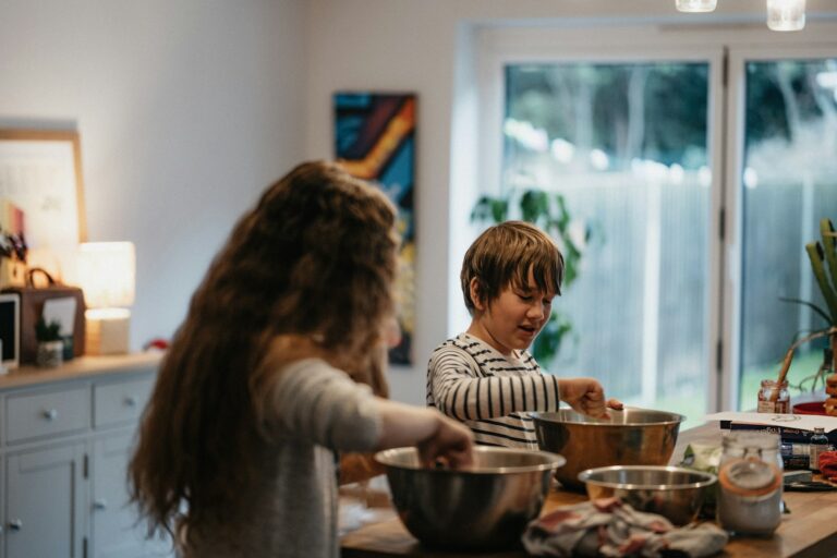 Parent cooking teenager kitchen