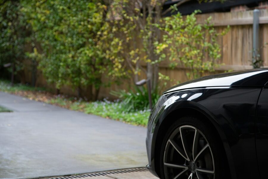 Parked car driveway weekend maintenance check