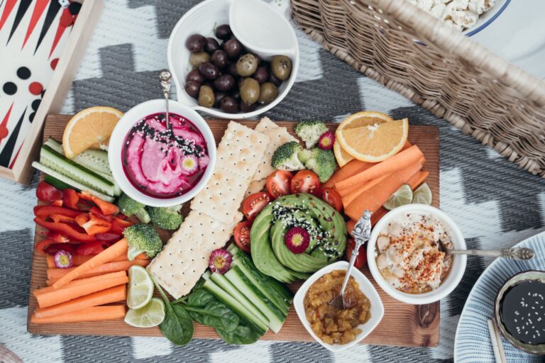 Family snack board crackers hummus vegetables kids party