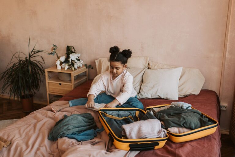 Child rolling clothes