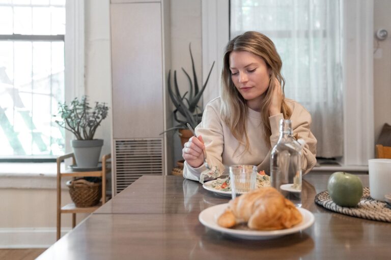 Woman eating salad
