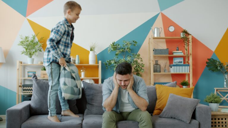 Parent child talking couch living room