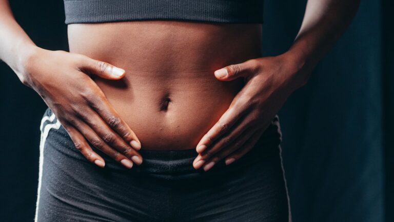 Close hands belly