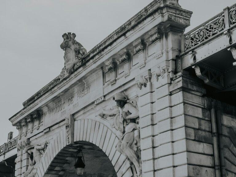 Ancient city gate stone arch pedestrians detail