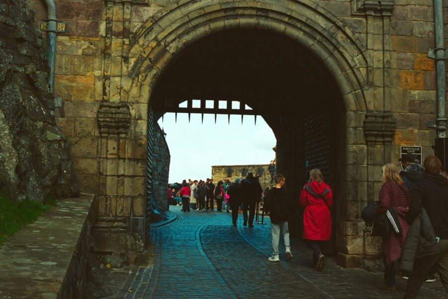 Ancient city gate stone arch pedestrians
