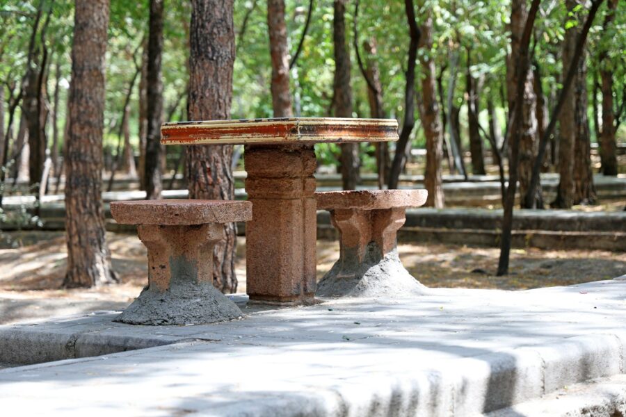 City park chess tables wooden chess pieces