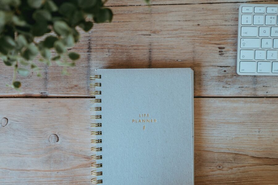 Desk planner pen coffee cup notebook