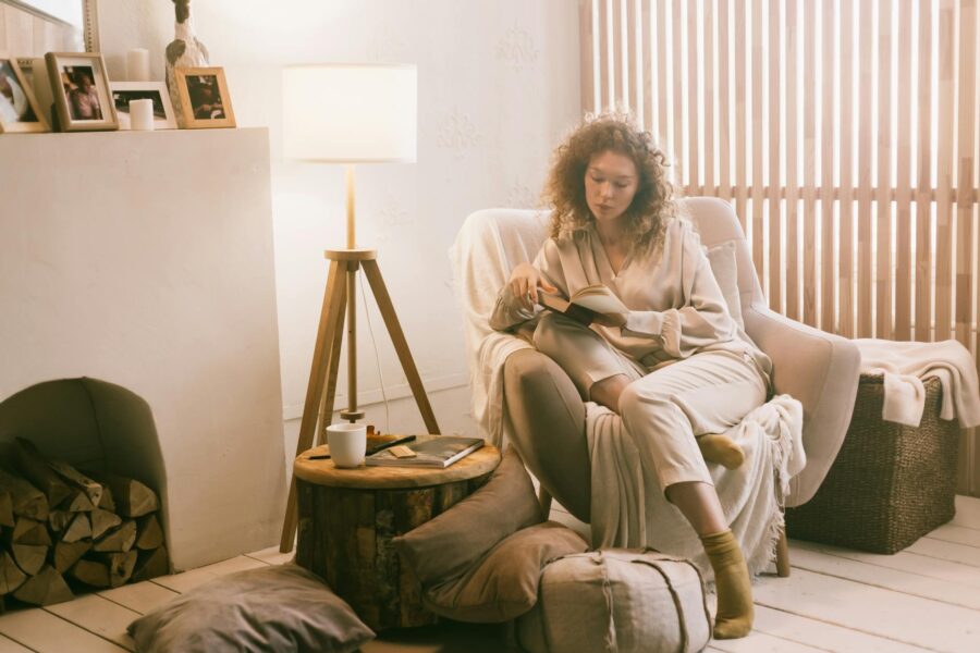 Cozy living room evening lamp book mug