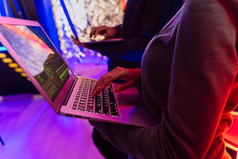 Person using laptop two factor authentication code detail