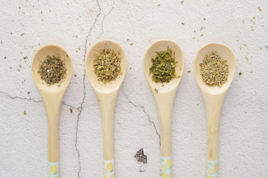 Cooked beans pot wooden spoon herbs