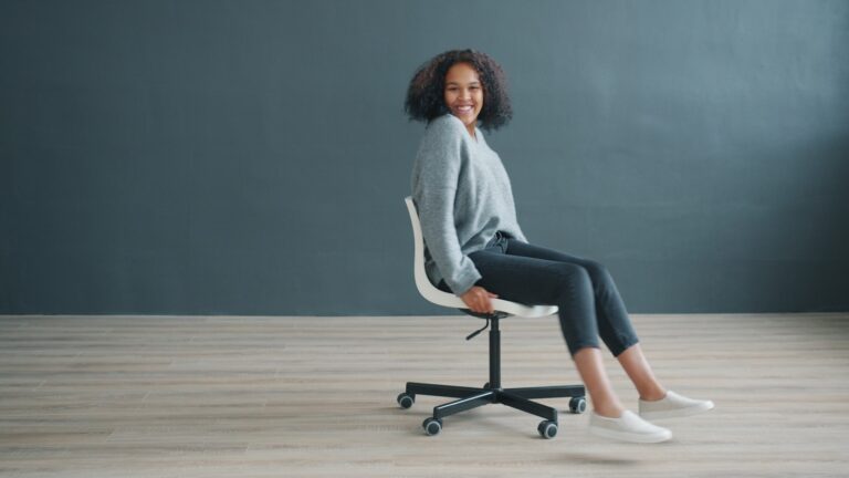 Office worker stretching legs desk chair
