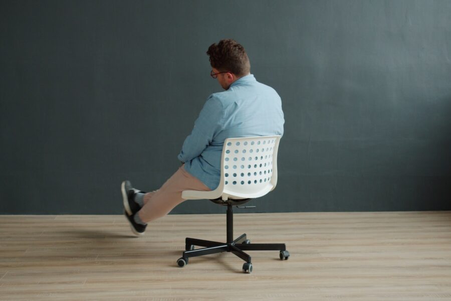 Office worker stretching legs desk chair