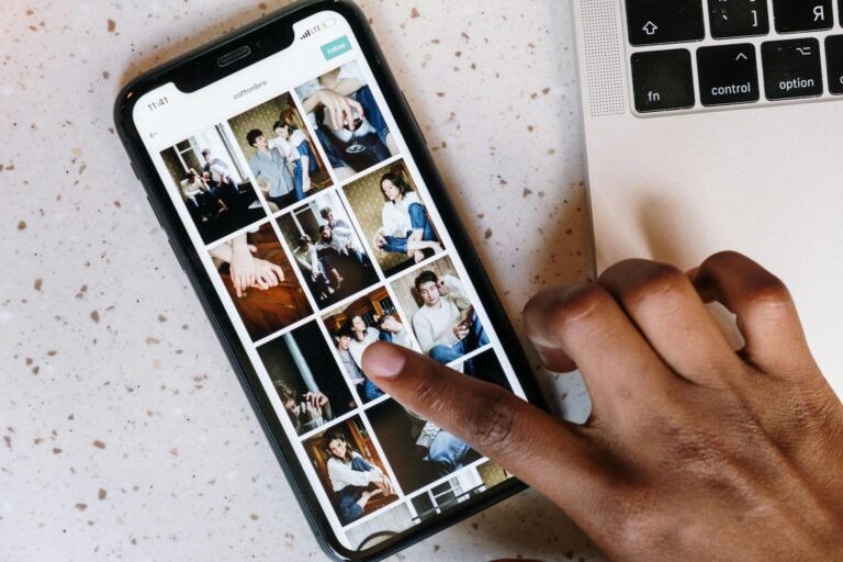 Person holding smartphone social media photos