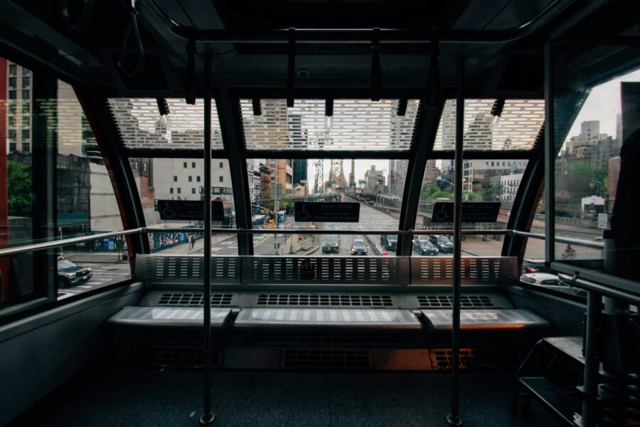 Tram interior commuters handrails city