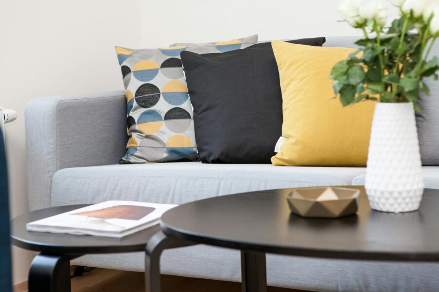 Neutral living room sofa soft textiles wooden coffee
