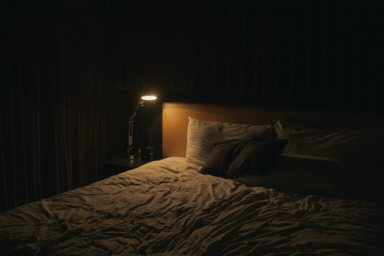 Cozy bedroom linen bedding warm lamp minimalist hallway